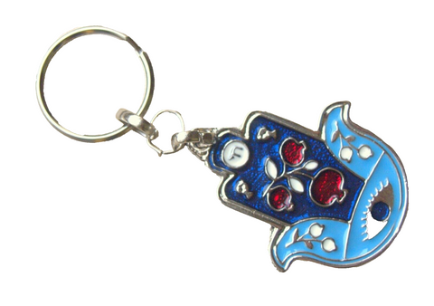 A blue enamel Judaica keyring keychain holder in the shape of a hamsa with pomegranate and evil eye designs, featuring a metal cast and colorful front enamel panel.